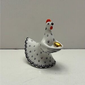 Porcelain white chicken with golden egg decor